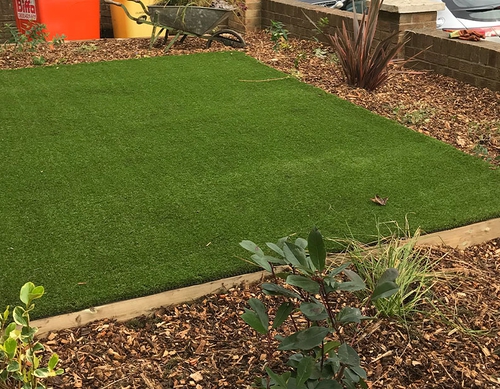 Artificial grass area in front garden.