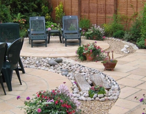 Paved feature patios in landscaped garden.